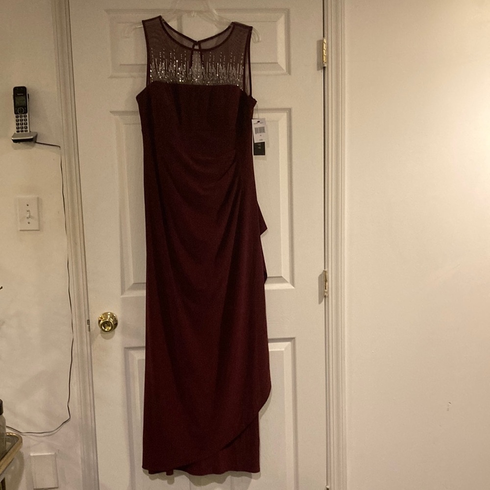 Brand new gown sz 14 Merlot color elegant for any fancy occasion. Tags attached